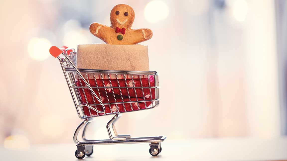 image of gingerbread man in shopping cart