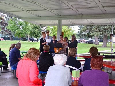 Image. JRMC Hospice sings a song in memory of their loved ones during the 2017 Memorial Service held by JRMC Hospice and the Jamestown Area Grief Support Team.