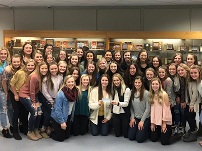 Jamestown High School Blue Jay volleyball team donates to JRMC.