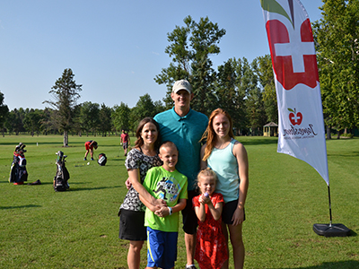 Image of Dr. Mandy and Dave Sorlie Family, founders of the ANGELS Fund at GOLF "fore" ANGELS tournament.