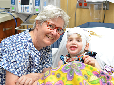 JRMC pediatric patient, Arianna Walch, receives 8-hour infusion for rare Batten's Disease and received new playground after first treatment.