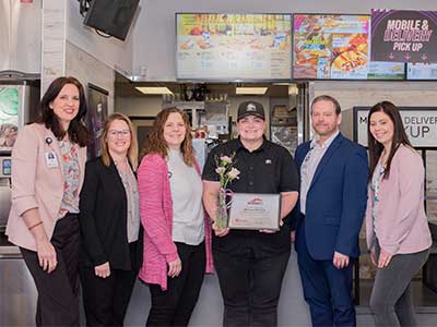 image of JRMC team with SHERO Melissa Burdick at Taco Bell