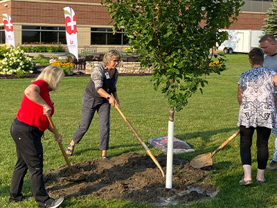 JRMC Hospice care team planting tree.