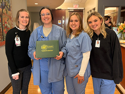 Image of Family BirthPlace nurses celebrating DAISY award recipient Tara Simonsen