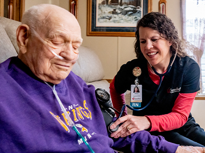 jrmc-registerd-nurse-cheryl-schiele-with-hospice-patient Image of JRMC Registered Nurse Cheryl Schiele