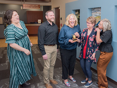 Jamie Heinley and Liz Mehus receive Legend Award.