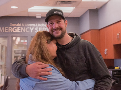 Deanna Amundson hugs her son, Mitch.