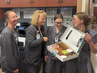 Image of nurses celebrating National Donut Day