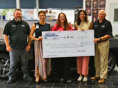 Image of R.M. Stoudt check presentation