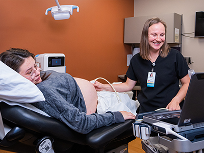 Image of JRMC OB/GYN Dr. Stromquist performing an ultrasound on a patient.