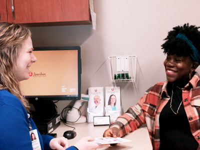 Women's Walk-in Clinic patient speaks with Nurse Practitioner Makenzie Breitbach.